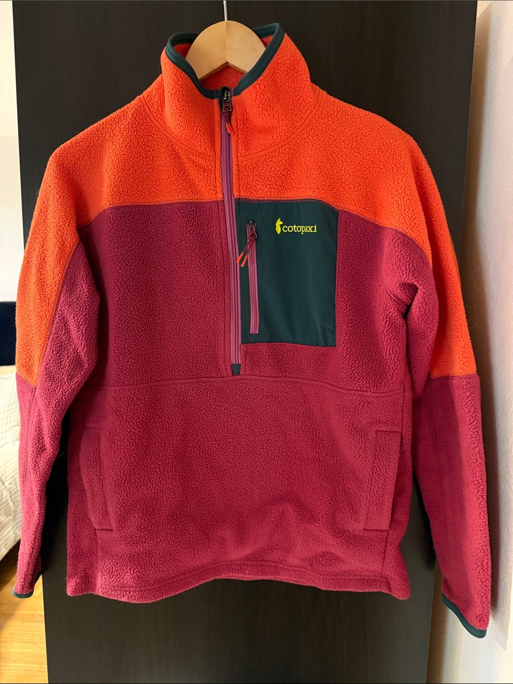 cotopaxi womenโs Half-Zip Fleece Pullover in Orange, Burgundy & Gray